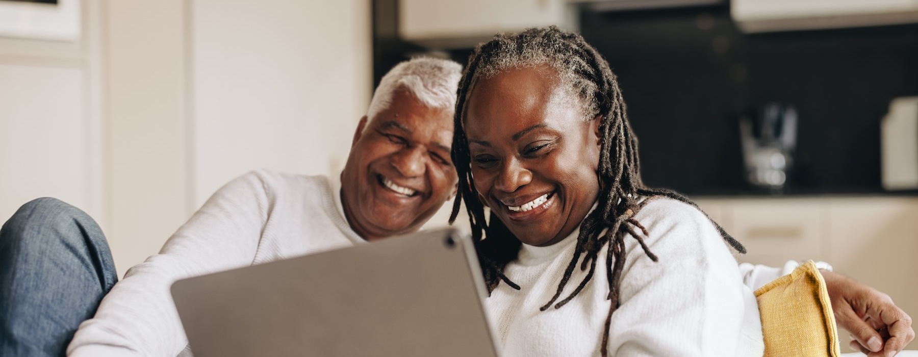 two people looking at a tablet