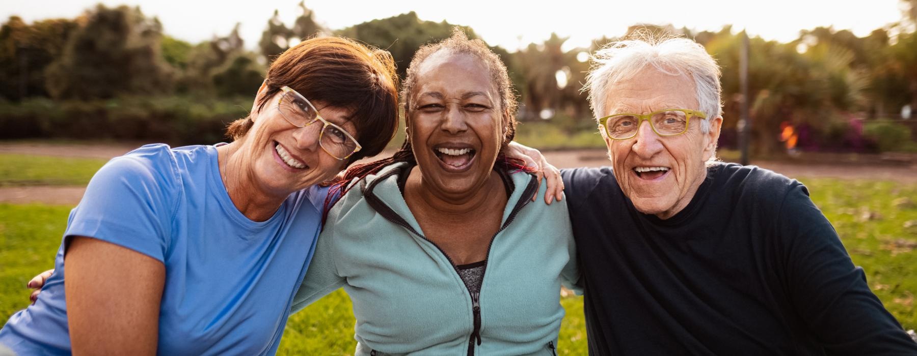 a group of people sitting together smiling